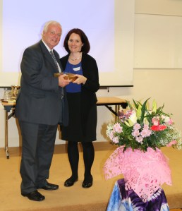 Nessa Ní Argadáin making a presentation to Dick Fields on the Silver Jubilee of Timirí